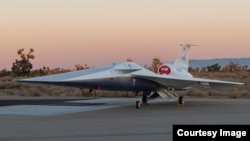 NASA’s X-59 supersonic research aircraft sits outside Lockheed Martin’s Skunk Works facility in Palmdale, California. (Image Credit: NASA Lockheed Martin Skunk Works)