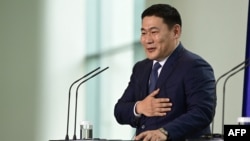 FILE - Mongolian Prime Minister Oyun-Erdene Luvsannamsrai gestures at a press conference during his visit to Germany, in Berlin, Oct. 14, 2022.