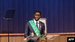 Bassirou Diomaye Faye gives his address as Senegal's President at an exhibition center in Diamniadio, near Dakar, Apr. 2, 2024. He is under pressure to make good on promises to crack down on corruption, improve livelihoods. 