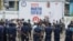 Security forces stand guard as they gather to prevent protests by supporters of presidential candidate Martin Fayulu outside his opposition party's headquarters in Kinshasa, Democratic Republic of the Congo, Dec. 27, 2023.