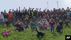 APTOPIX Britain Cheese Rolling