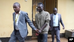 FILE - Collins Jumaisi Khalusha leaves court in Nairobi, Kenya, July 16, 2024. Khalusha, who police say confessed to killing 42 women, escaped Tuesday from a police station along 12 other inmates.