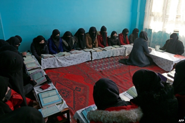 FILE - In this picture taken on February 13, 2023, Afghan girls learn the holy Koran at a madrassa or an Islamic school on the outskirts of Kabul. - Islamic schools have grown across Afghanistan since the Taliban returned to power in August 2021. (Photo by AFP)