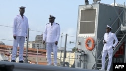 FILE - Senegalese Navy officers stand on the OPV 58S 'Walo' vessel in the quay of the naval base in Dakar on August 3, 2023.