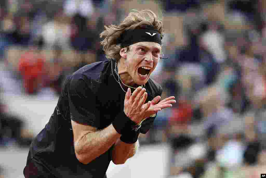 Russia's Andrey Rublev vents his frustration after missing a shot against Italy's Matteo Arnaldi during their third round match of the French Open tennis tournament at the Roland Garros stadium in Paris.