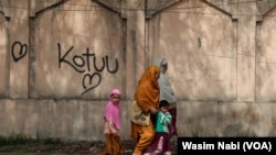 Kashmiri women walk along with their children in Srinagar, India-administered Kashmir. (Wasim Nabi)