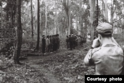 Nate Thayer (right) looked on as FULRO soldiers greeted UN soldiers in Mondulkiri province in 1992. Photo: Nate Thayer collection.