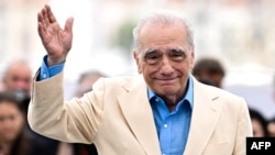 FILE - Director Martin Scorsese waves during a photo call for the film "Killers of the Flower Moon" at the Cannes Film Festival in Cannes, France, on May 21, 2023. Scorsese has backed a petition against the jailing of Iranian director Saeed Roustaee.