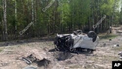 Photo released by the Russian Investigative Committee, May 6, 2023, shows the exploded car of Russian writer and publicist Zakhar Prilepin near Nizhny Novgorod, east of Moscow.