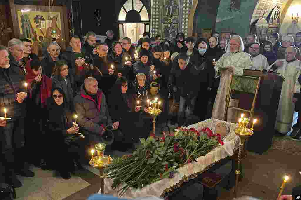 Relatives and friends pay their last respects at the coffin of Russian opposition leader Alexey Navalny in the Church of the Icon of the Mother of God Soothe My Sorrows, in Moscow, Russia, March 1, 2024.