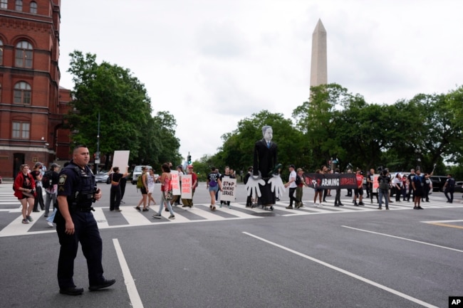 A large effigy of Israeli Prime Minister Benjamin Netanyahu, center, is seen as protesters attempt to block streets, July 24, 2024, in Washington, ahead of a Netanyahu's visit to the U.S. Capitol.