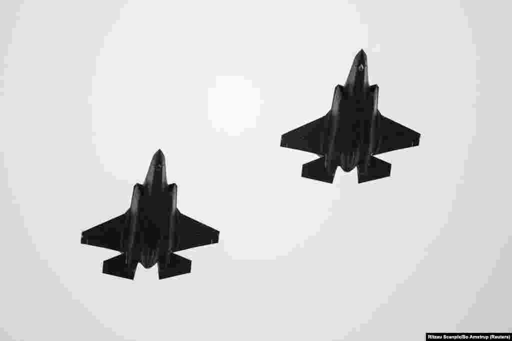 Two F-35 fighter jets return to Flyvestation Skrydstrup air base after patrolling around Denmark at low altitude.