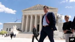 FILE - Idaho Attorney General Raúl Labrador leaves after talking to reporters outside the Supreme Court, April 24, 2024, in Washington.