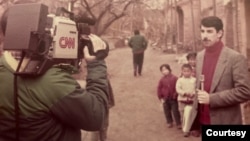 FILE - Correspondent Mike Chinoy reports from China in 1984 on a trip in advance of Ronald Reagan's state visit, three years before Chinoy opened the CNN Beijing bureau. (Courtesy of Mike Chinoy)