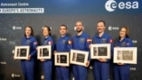 From left, Rosemary Cooga, Sophie Adenot, Raphael Liegeois, Pablo Alvarez Fernandez, Marco Sieber and Katherine Bennell-Pegg hold their certificates at the graduation ceremony at the European Astronaut Centre in Cologne, Germany, April 22, 2024.