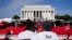 A crowd listens to speakers during an event to commemorate the 60th anniversary of the March on Washington for Jobs and Freedom at the Lincoln Memorial in Washington, Aug. 26, 2023.
