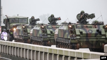 China warns of Taiwan 'war' as military drills encircle island