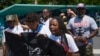 Hundreds march in US to honor Eric Garner, call for police accountability