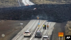 The lava flow that crossed Grindavikurvegur, the road to Grindavik in Iceland, in seen March 17, 2024, a day after the volcanic eruption. 