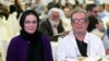 FILE - In this photo taken on July 7, 2015, and provided by the Iranian Students' News Agency, ISNA, Iranian film director Dariush Mehrjui and his wife, Vahideh Mohammadifar attend a film directors' meeting in Tehran, Iran.