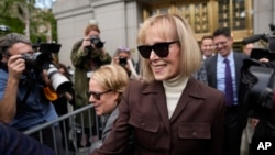 E. Jean Carroll walks out of Manhattan federal court, May 9, 2023, in New York. A jury has found Donald Trump liable for sexually abusing her in 1996, awarding her $5 million in a judgment. Trump is appealing the decision. (AP Photo/Seth Wenig)