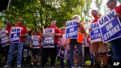 United Auto Workers members and supporters picket outside a General Motors facility in Langhorne, Pa., Sept. 22, 2023.