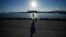 An angler fishes at Onahama Port in Iwaki, northeastern Japan, 68 kilometers from the Fukushima Daiichi nuclear power plant, damaged by a massive March 11, 2011, earthquake and tsunami, on Aug. 25, 2023. 