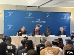 David Carroll, right, and others from the Carter Center, one group observing the election, present their election report in Harare, Aug. 25 2023. They expressed doubt there was any reason for the arrests of election monitors. (Columbus Mavhunga/VOA)