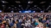 Messengers stand for worship during a Southern Baptist Convention annual meeting, June 11, 2024, in Indianapolis. 