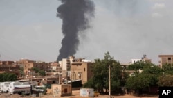 FILE - Smoke rises over Khartoum, Sudan, on June 8, 2023, during the conflict between the Sudanese army and paramilitary Rapid Support Forces.