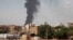 FILE - Smoke rises over Khartoum, Sudan, on June 8, 2023, as fighting between the Sudanese army and paramilitary Rapid Support Forces continues. 
