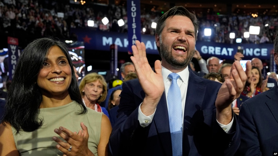 Republican vice presidential candidate Sen. J.D. Vance, R-Ohio, and his wife Usha Chilukuri Vance arrive on the floor during the first day of the 2024 Republican National Convention at the Fiserv Forum, in Milwaukee, July 15, 2024. 