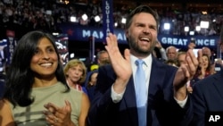 Republican vice presidential candidate Sen. J.D. Vance, R-Ohio, and his wife Usha Chilukuri Vance arrive on the floor during the first day of the 2024 Republican National Convention at the Fiserv Forum, in Milwaukee, July 15, 2024. 