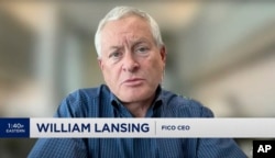 In this screenshot taken from video, William Lansing, the CEO of FICO, is interviewed on CNBC. Lansing was among the highest paid CEO's in 2023 according to an Associated Press survey. (CNBC via AP)
