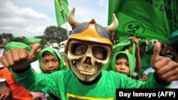 Pendukung Partai Persatuan Pembangunan (PPP) saat kampanye pemilu di Jakarta pada 18 Maret 2009. (Foto: Bay Ismoyo/AFP)