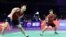Feng Yanzhe (L) of China hits a return beside partner Huang Dongping during their mixed doubles match against Hana Tarek Zaher and Ahmed Salah of Egypt at the Sudirman Cup Finals 2023 world badminton championships in Suzhou, China, May 14, 2023.