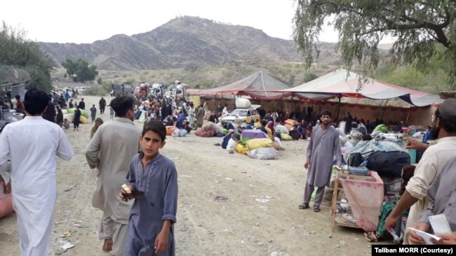 FILE - Afghans returning from Pakistan in this undated photo.