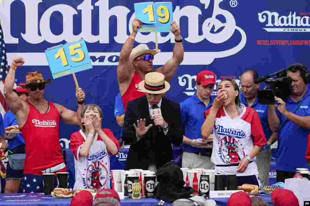 Miki Sudo, right, and Mayoi Ebihara, left, compete in the women&#39;s division of Nathan&#39;s Famous Fourth of July hot dog eating contest at Coney Island in the Brooklyn borough of New York.&nbsp;Sudo won by eating a record 51 hot dogs.&nbsp;