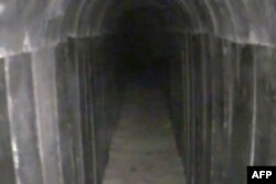 FILE - This image from video released by the Israeli army Aug. 15, 2022, reportedly shows a tunnel leading out of the Gaza Strip into Israel, dug by the Palestinian enclave's Hamas rulers, which the army said it had discovered and blocked.