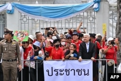 Supporters of former Thai Prime Minister Thaksin Shinawatra gather outside Thailand's Supreme Court in Bangkok, Aug. 22, 2023.