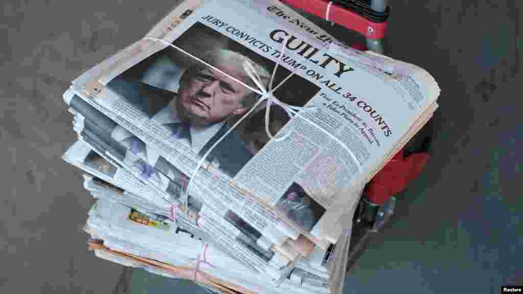 A copy of the New York Times featuring an image of former U.S. president Donald Trump is delivered the day after the verdict in his criminal trial over charges that he falsified business records, in New York City.
