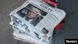 A copy of the New York Times featuring an image of former U.S. president Donald Trump is delivered the day after the verdict in his criminal trial over charges that he falsified business records, in New York City.