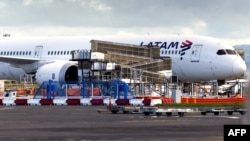 The LATAM Airlines Boeing 787 Dreamliner plane that suddenly lost altitude mid-flight a day earlier, dropping violently and injuring dozens of terrified travelers, is seen on the tarmac of the Auckland International Airport in Auckland on March 12, 2024. 