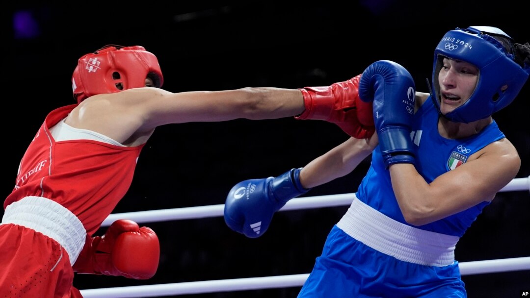 Algeria's Imane Khelif, left, fights Angela Carini of Italy in their women's 66-kilogram preliminary boxing match at the 2024 Summer Olympics on Aug. 1, 2024, in Paris, France. Khelif won after Carini abandoned the fight after 46 seconds.
