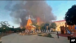 This photo taken from video released by Golos Dagestana shows smoke rising following an attack in Makhachkala, republic of Dagestan, Russia, June 23, 2024. (Golos Dagestana via AP)