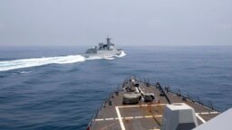 In this photo provided by the U.S. Navy, the USS Chung-Hoon observes a Chinese navy ship conduct what it called an "unsafe” Chinese maneuver in the Taiwan Strait, June 3, 2023. (Mass Communication Specialist 1st Class Andre T. Richard/U.S. Navy via AP)