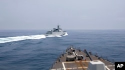 In this photo provided by the U.S. Navy, the USS Chung-Hoon observes a Chinese navy ship conduct what it called an "unsafe” Chinese maneuver in the Taiwan Strait, June 3, 2023. (Mass Communication Specialist 1st Class Andre T. Richard/U.S. Navy via AP)