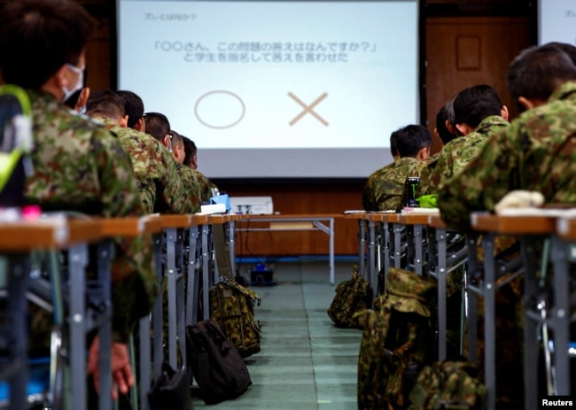 Japan Ground Self-Defence Force (JGSDF) soldiers participate in a seminar to prevent harassment at JGSDF Camp Asaka, in Tokyo, Japan April 16, 2024. (REUTERS/Sakura Murakami)