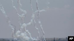 Rockets are launched by Palestinian militants from the Gaza Strip toward Israel, in Gaza, May 13, 2023.