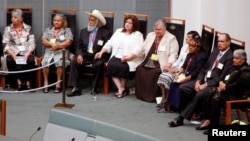 FILE - Members of Australia's Stolen Generation listen to Australian Prime Minister Kevin Rudd deliver his speech where he apologized to its indigenous people for past treatment in Canberra, Australia, Feb. 13, 2008.